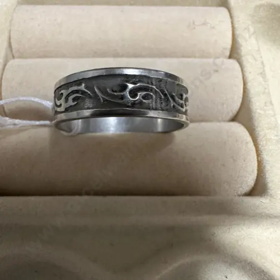 Silver Coloured Ring With Pattern On Top