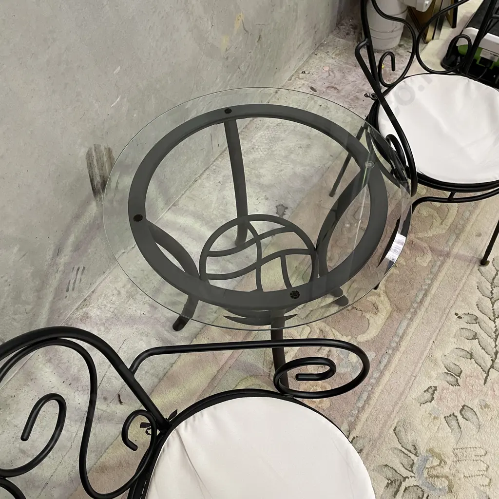 3 Piece Outdoor/Indoor Set. Glass top table with metal frame. Black metal framed chairs, excellent condition Image 1++
