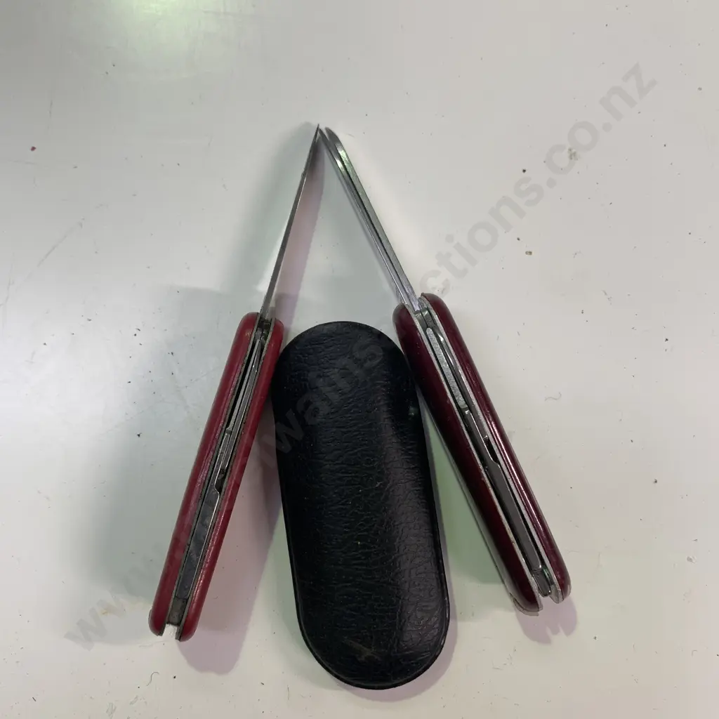 Bechtel Vitorinox Switzerland Small Pocket Knife in cover with one other small Stainless Pocket Knife Image 1++