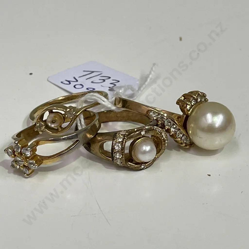 Four gold coloured rings with assorted stones. Some stamped Image 1++