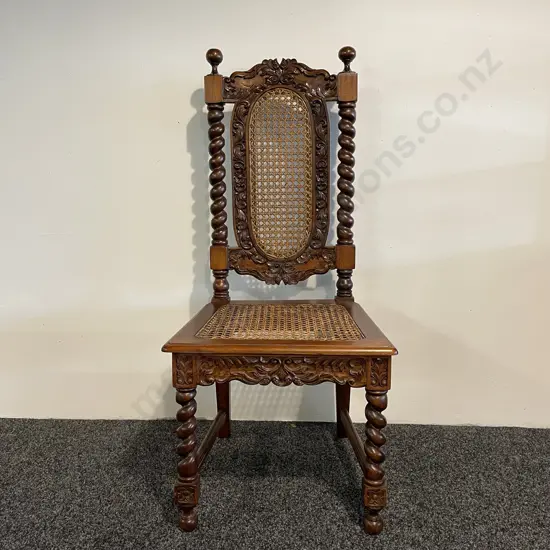Antique Cane Filled High Back Chair. Rope legs and top with ornately carved detail. H112cm