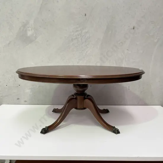 Antique Solid Mahogany Oval Coffee Table. Brass claw feet