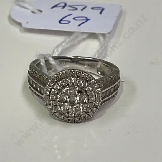 Stunning Dress Ring. Marked 375 (one stone missing)