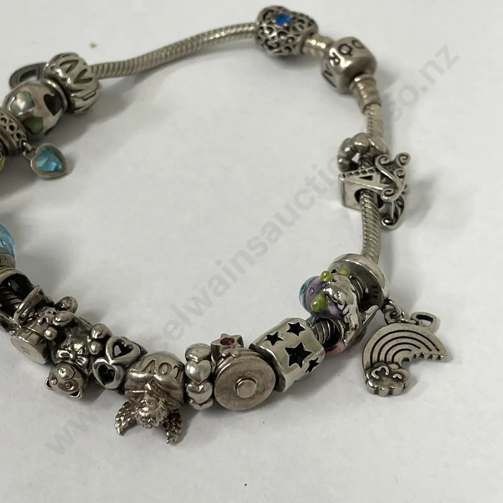 Pandora Bracelet with large assortment of Charms Image 1++