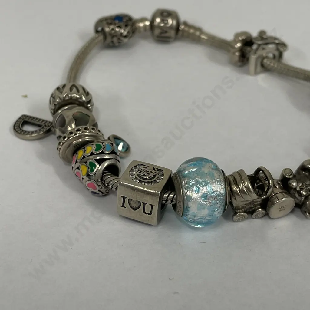 Pandora Bracelet with large assortment of Charms Image 1++