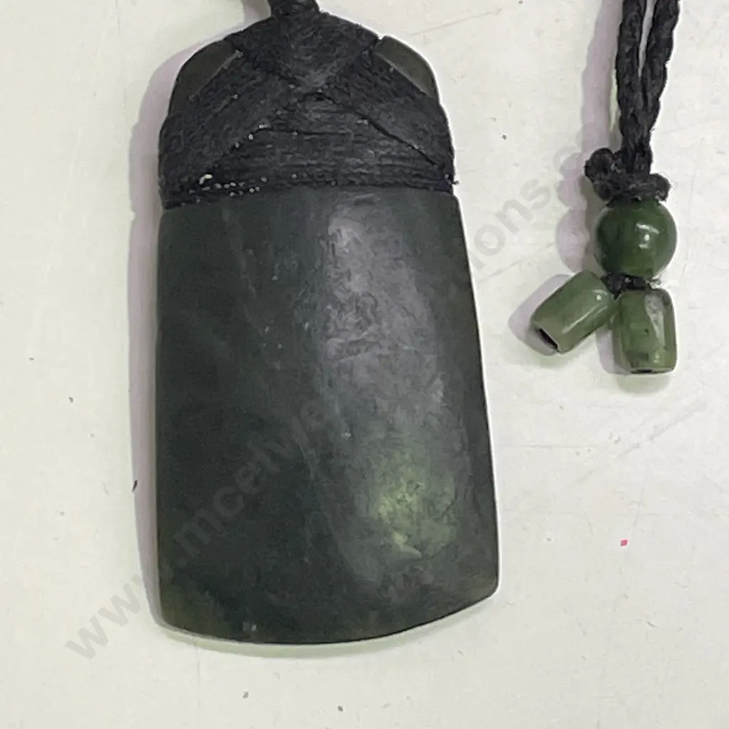 Greenstone Pounamu with rope necklace and greenstone tie ends. Image 1++