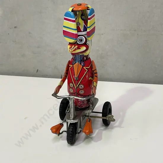 Vintage Wind Up Toy of Duck Riding Bike. Good working condition. With original Box