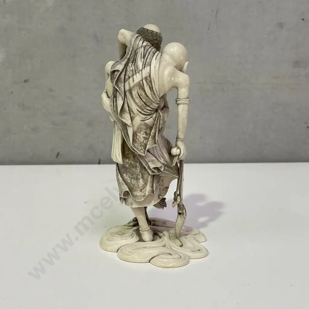 Intricately Carved Fine Ivory Okimono. Rakkan attempting to pull a Kappa from the Sea. H18cm. Base claw is detached. Image 1++