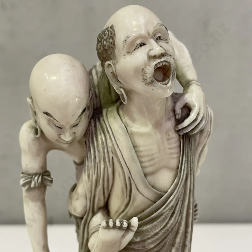 Intricately Carved Fine Ivory Okimono. Rakkan attempting to pull a Kappa from the Sea. H18cm. Base claw is detached. Image 1++
