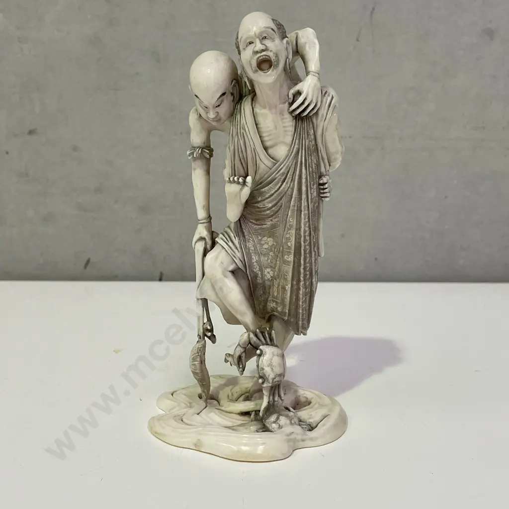 Intricately Carved Fine Ivory Okimono. Rakkan attempting to pull a Kappa from the Sea. H18cm. Base claw is detached. Image 1++