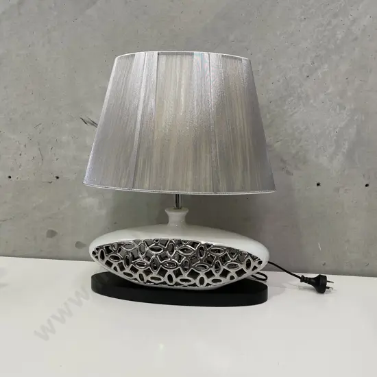 Stunning Modernist Table Lamp. Ceramic and Silver squat shape on black wooden plinth. Silver shade. H51 W40cm. Working.