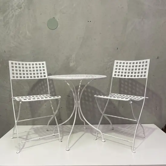 3 Piece Outdoor/Patio Table and 2 chairs. Square slat white painted heavy iron. Folding Chairs