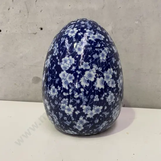 Large Ceramic Egg. Flow blue and white prunus pattern. H23cm