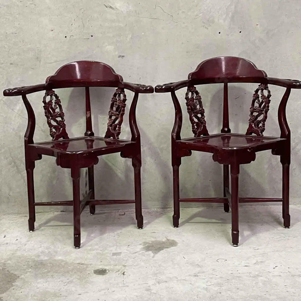 Pair of Vintage Chinese Rosewood Armchairs. Cross base with oval high back plate and intricately carved panels and arms. Image 1++