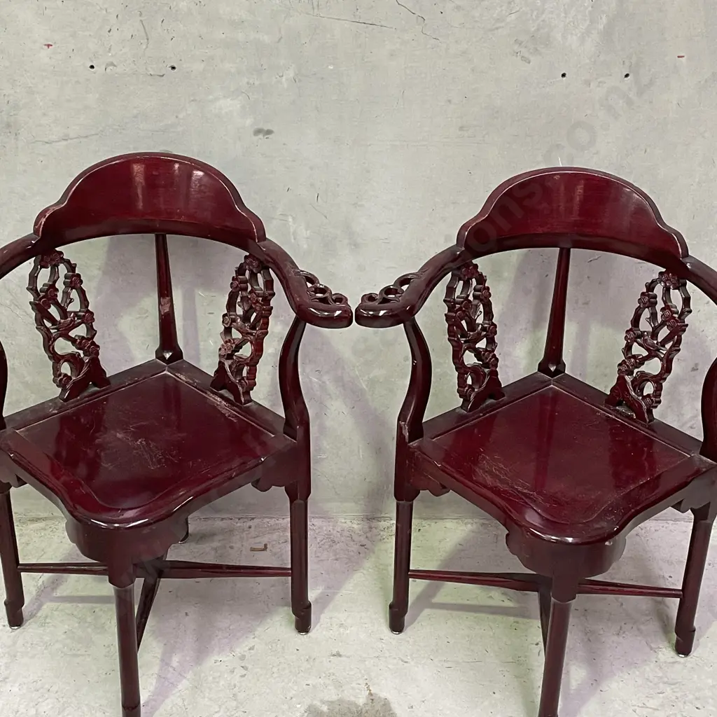 Pair of Vintage Chinese Rosewood Armchairs. Cross base with oval high back plate and intricately carved panels and arms. Image 1++