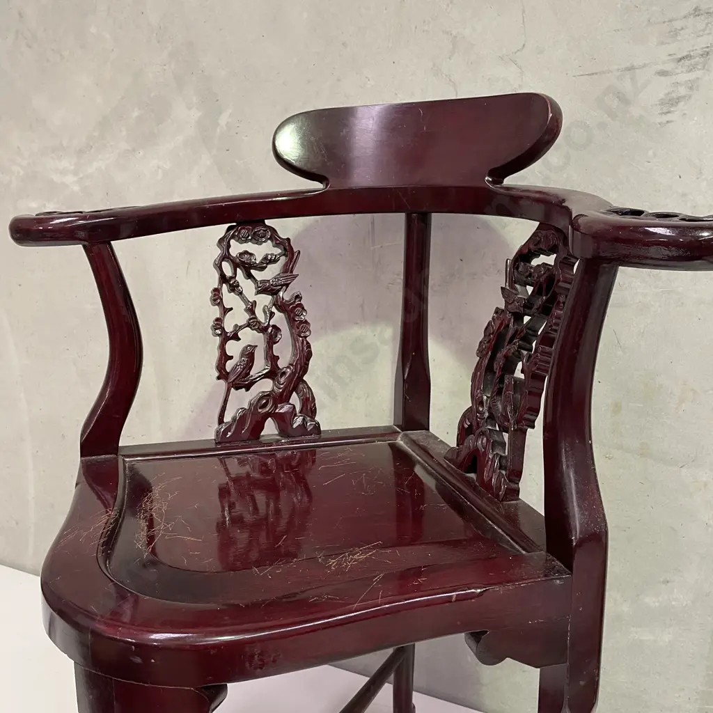 Pair of Vintage Chinese Rosewood Armchairs. Cross base with oval high back plate and intricately carved panels and arms. Image 1++
