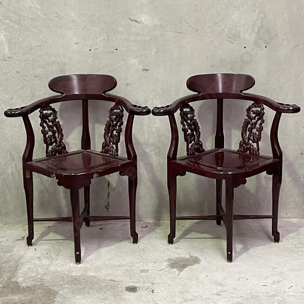Pair of Vintage Chinese Rosewood Armchairs. Cross base with oval high back plate and intricately carved panels and arms. Image 1++