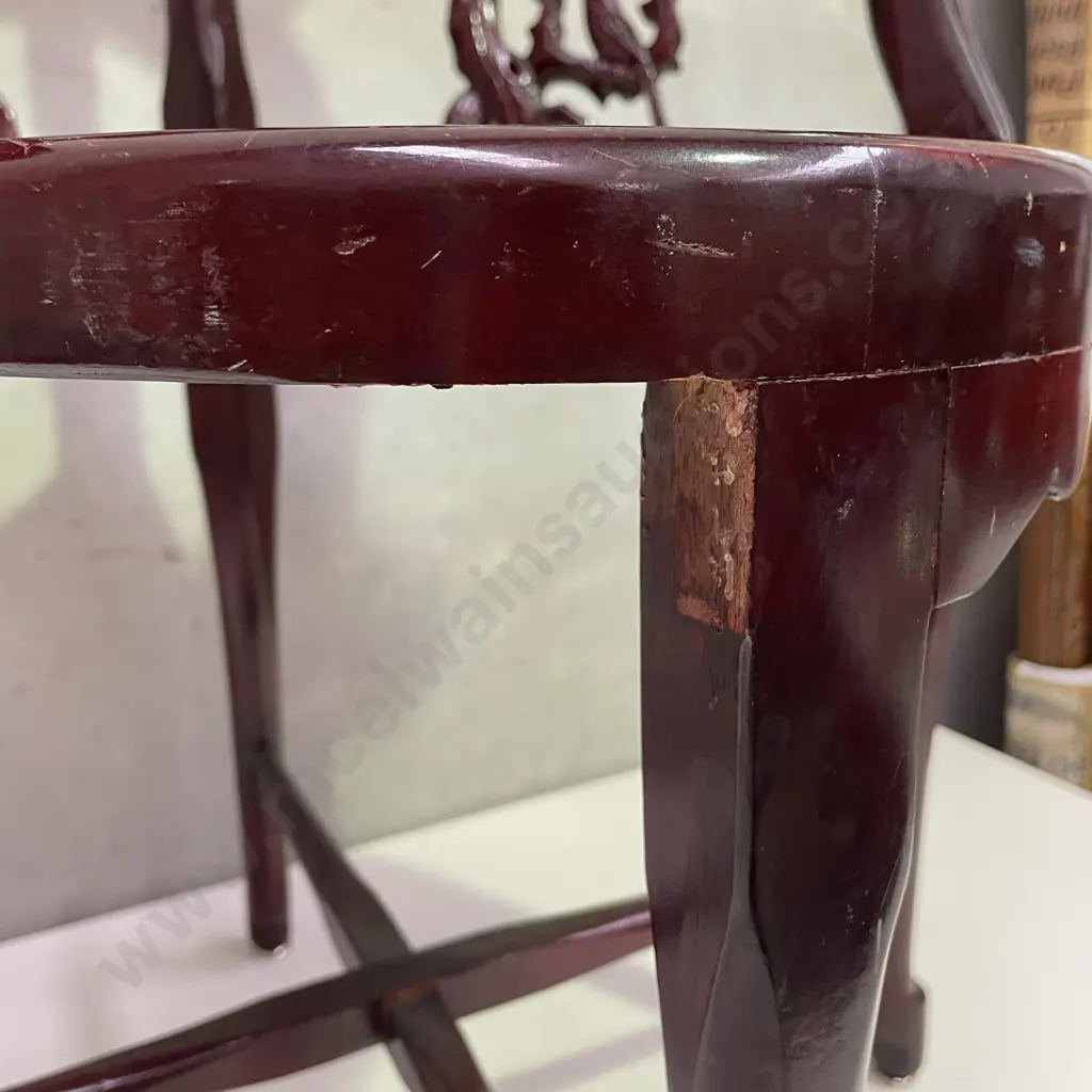 Pair of Vintage Chinese Rosewood Armchairs. Cross base with oval high back plate and intricately carved panels and arms. Image 1++