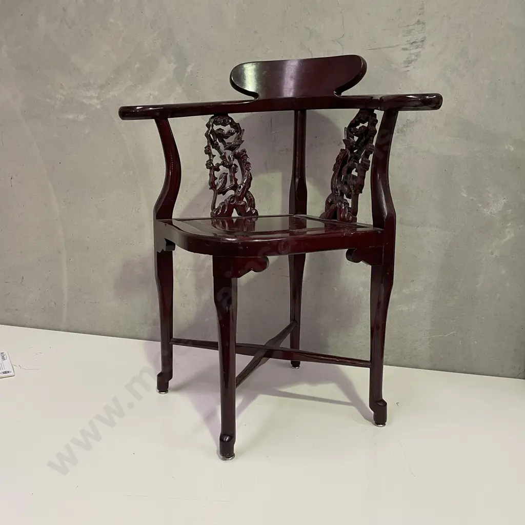 Pair of Vintage Chinese Rosewood Armchairs. Cross base with oval high back plate and intricately carved panels and arms. Image 1++