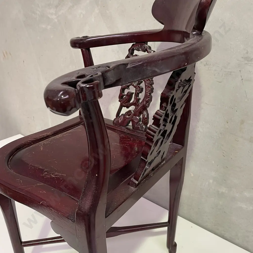 Pair of Vintage Chinese Rosewood Armchairs. Cross base with oval high back plate and intricately carved panels and arms. Image 1++