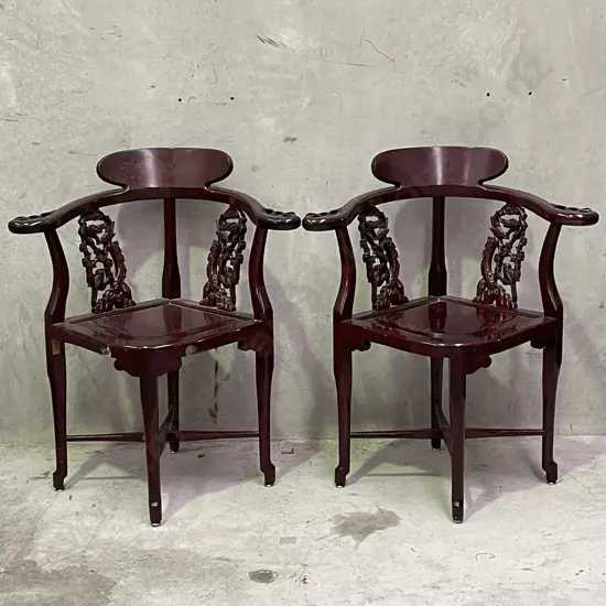 Pair of Vintage Chinese Rosewood Armchairs. Cross base with oval high back plate and intricately carved panels and arms.