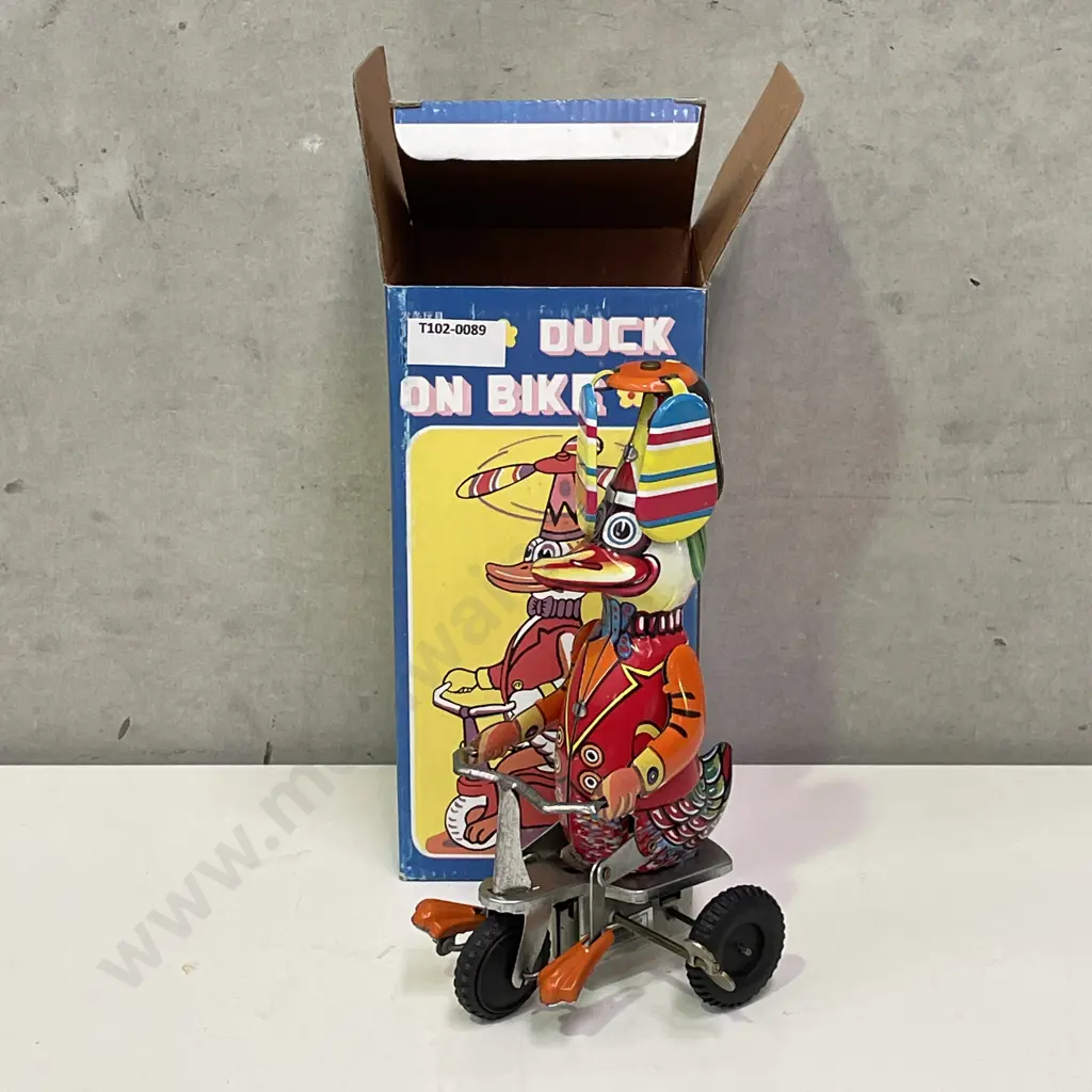 Vintage Wind Up Toy of Duck Riding Bike. Good working condition. With original Box Image 1++