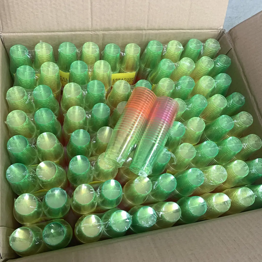 5 x Boxes of Celebity Celebration Multi-coloured shot glasses. Each box contains 160 units Image 1++
