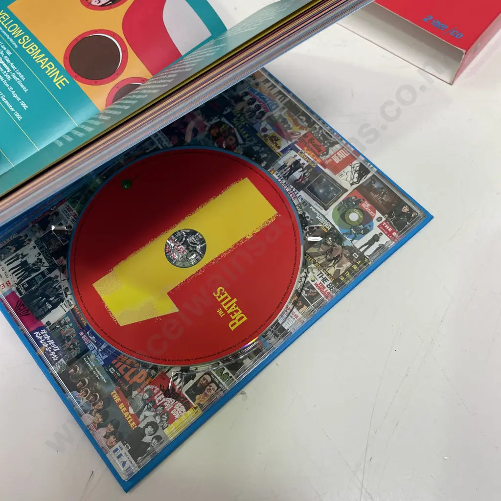 Boxed Beatles 1+ Commemorative DVD and CD Set Image 1++