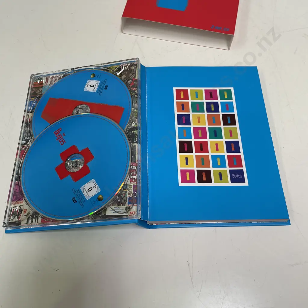 Boxed Beatles 1+ Commemorative DVD and CD Set Image 1++