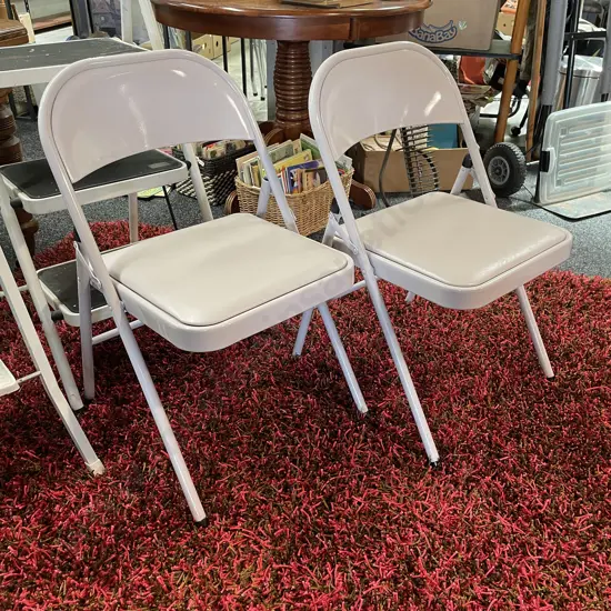 Pair Weco metal folding Chairs with vinyl padded seat. As new