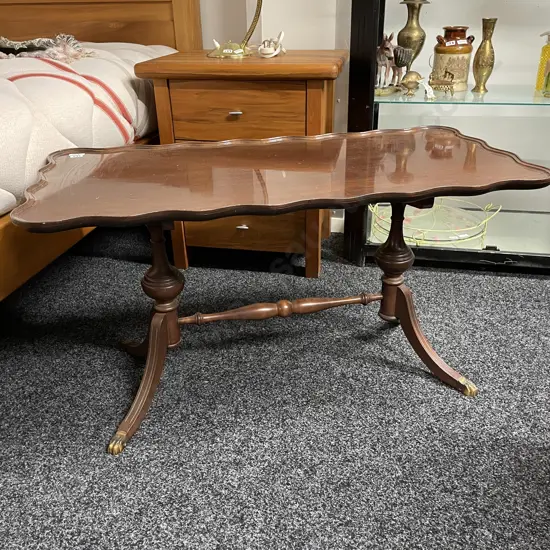 Antique Solid Mahogany Occassional Table. Wave edge, dual base, brass claw feet. Top 91x45cm H50cm