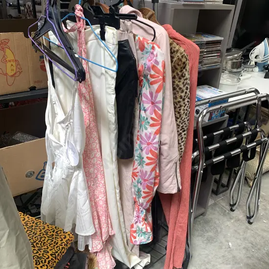 Selection of size 8-10 clothing, some new with tags, including clothes rack