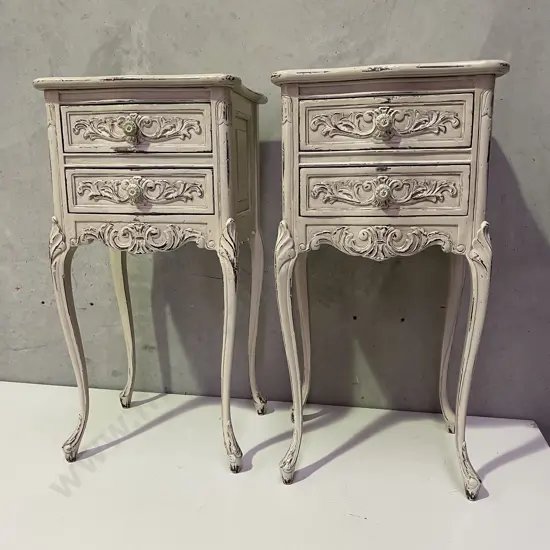 Pair French Style 2 drawer bedside cabinets. Ivory painted and ornately carved. H74 W36 D30cm
