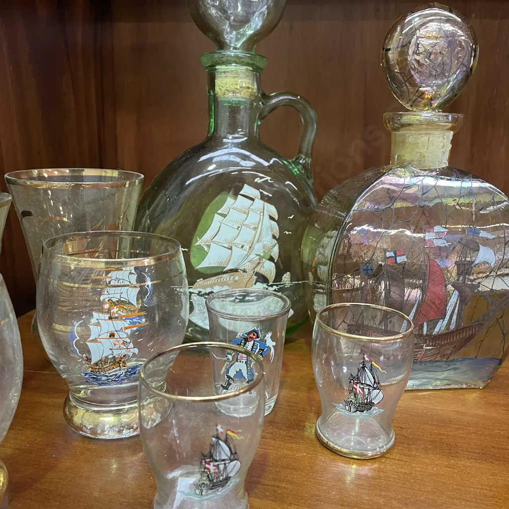 Two Vintage Glass Decanters with handpainted and gilded ship decoration. With assorted Ship themed glasses. Image 1++