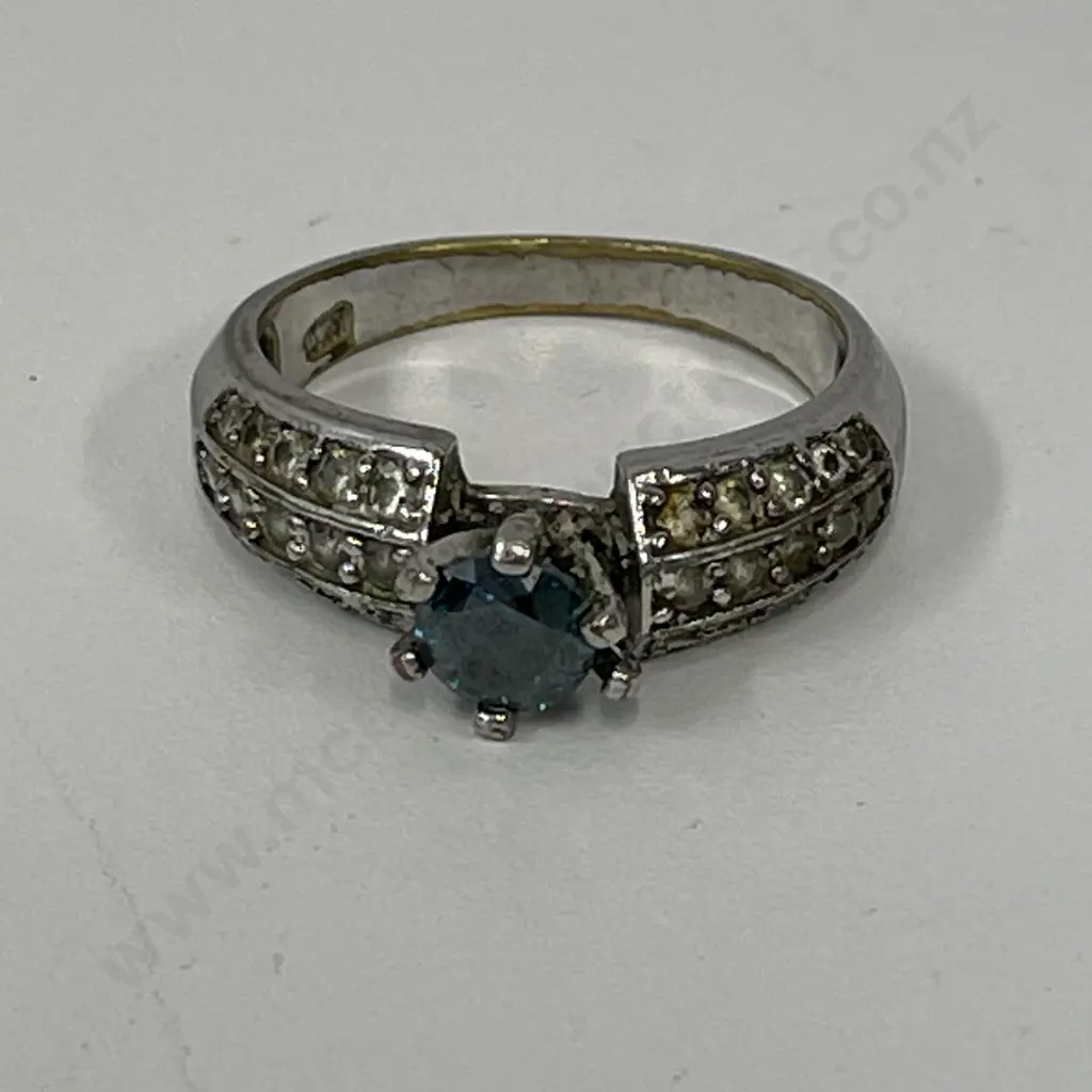 Dress Ring with clear stones and single green stone. Stamped - unreadable Image 1++
