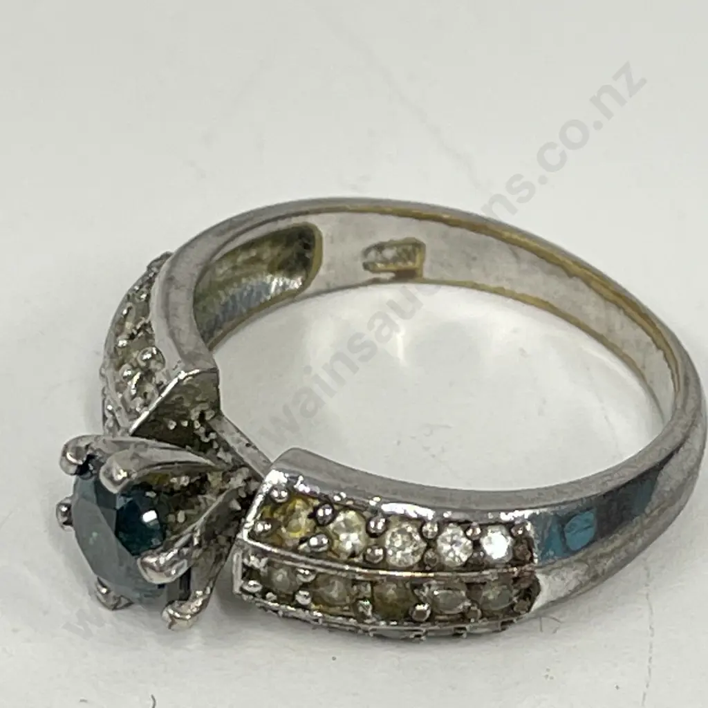 Dress Ring with clear stones and single green stone. Stamped - unreadable Image 1++