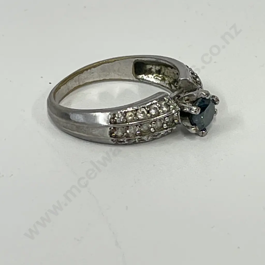 Dress Ring with clear stones and single green stone. Stamped - unreadable Image 1++