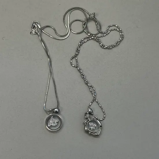 Two Stamped Silver Necklaces with Pendants. Stamped 18K and 80