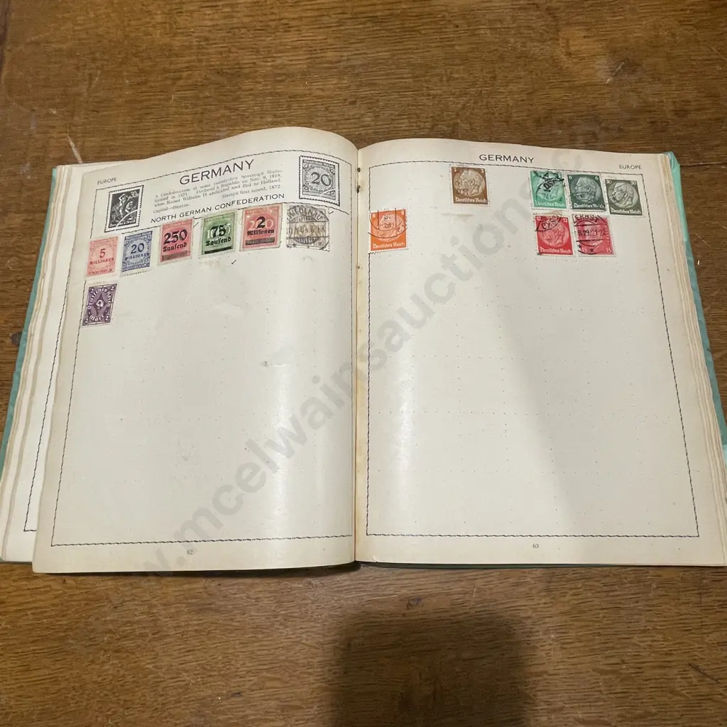 Stamp Album with Assorted Stamps Image 1++