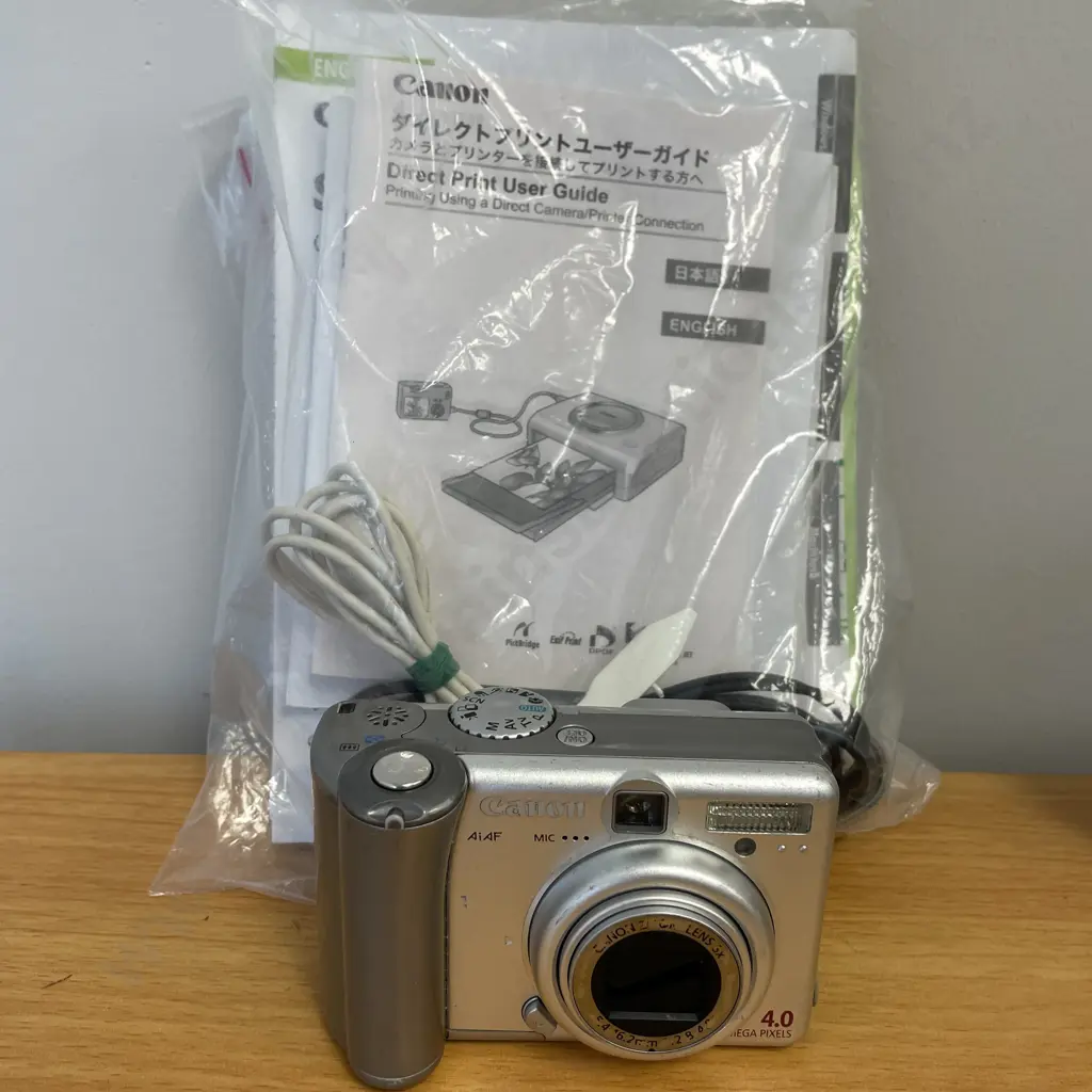 Canon AiAF 4.0 Mega Pixels Camera with acccessories and manuals Image 1++