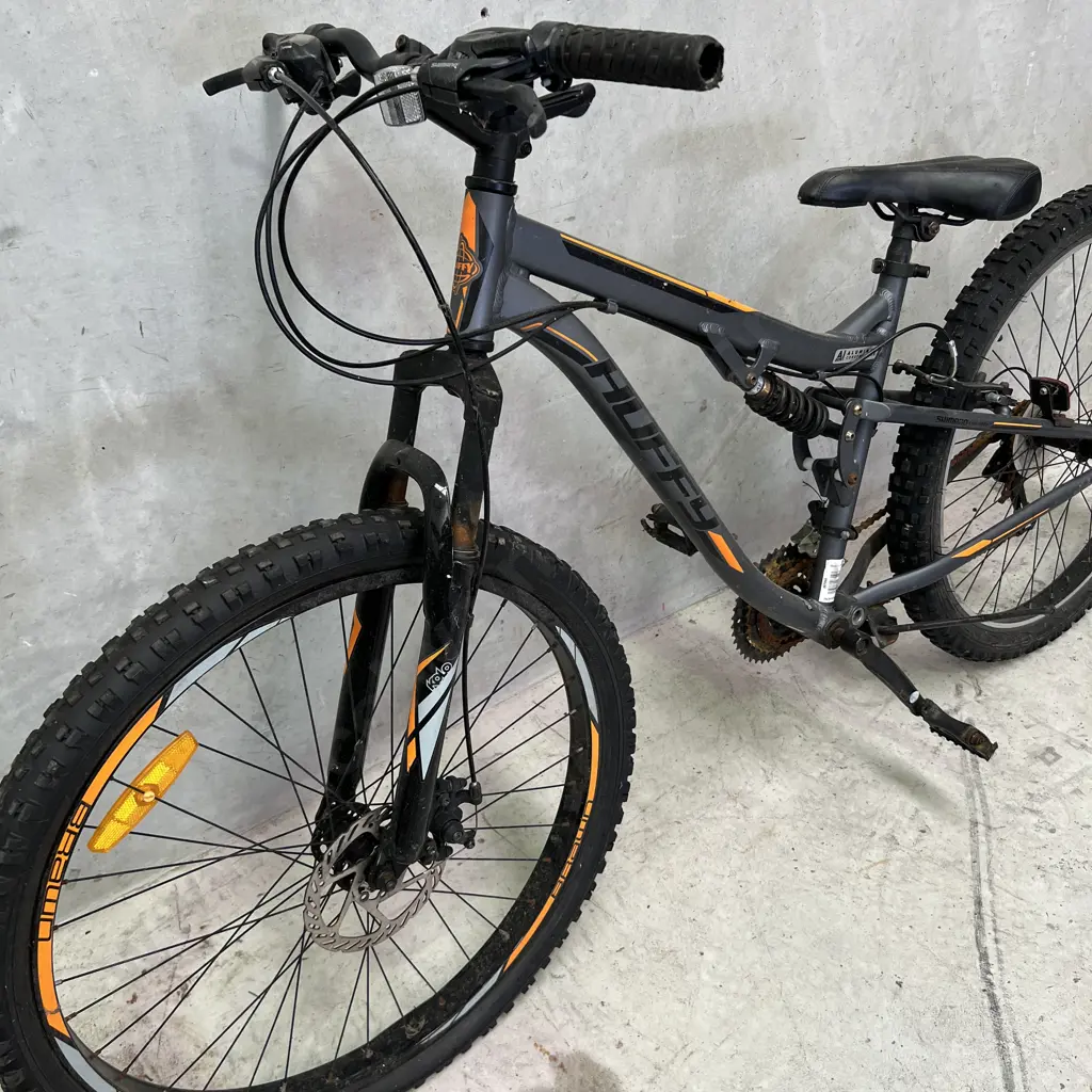Huffy Brawn 70cm Mountain Bike. Grey with black and orange. Serial No. AH21B043725 Image 1++