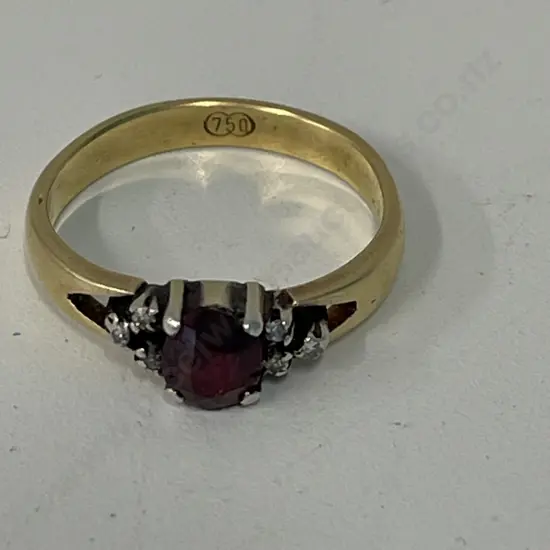 18CT Gold Ring with Ruby and diamonds. Stamped 750