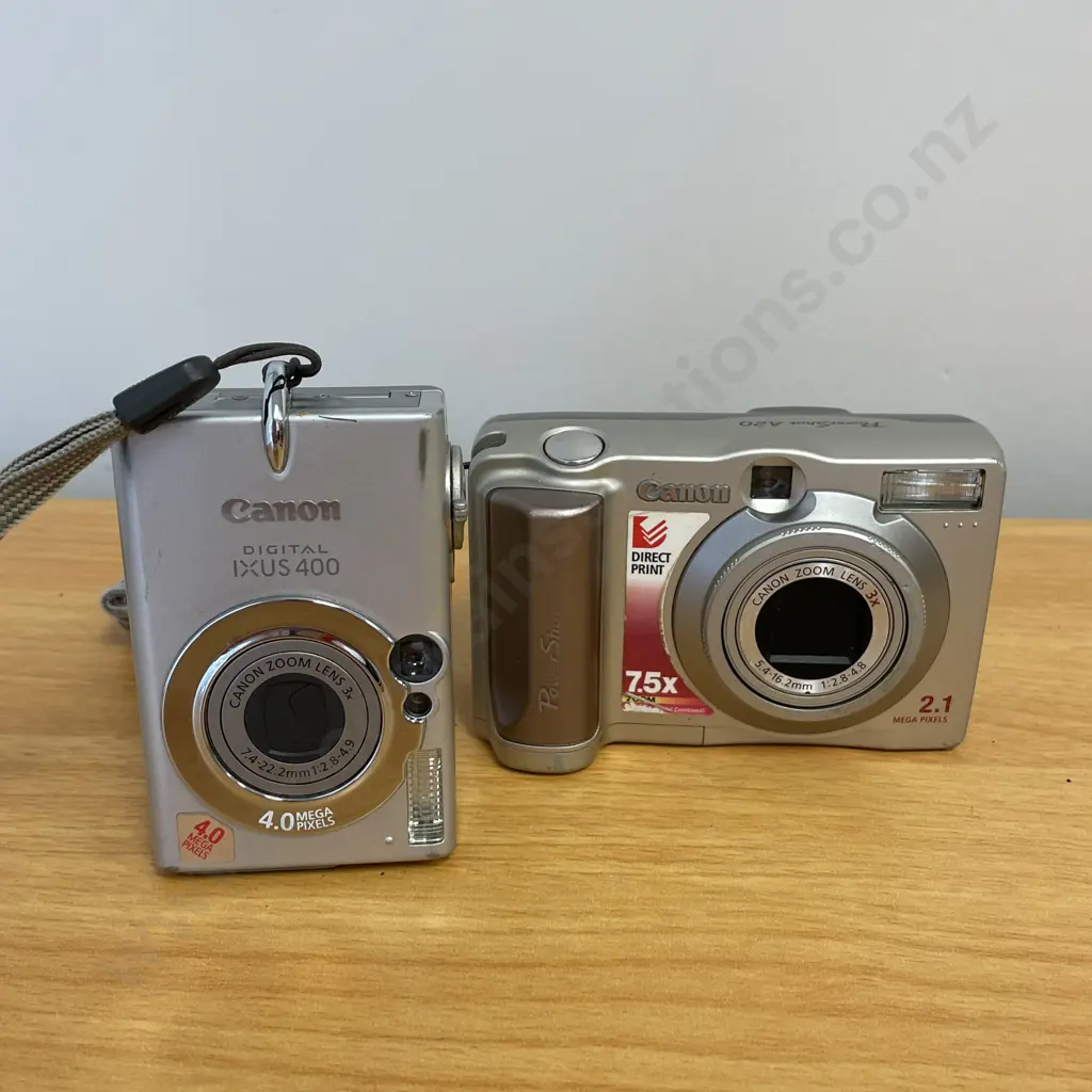 Two Canon Digital Cameras. IXUS400 and Powershot A20 Image 1++