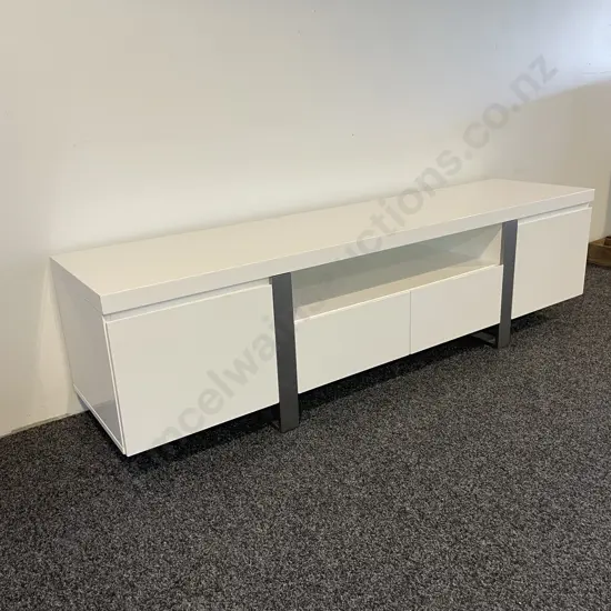 Modernist High Gloss White Painted Entertainment Unit. 2 Door, 2 Drawer. Chrome Frame/Legs. H50 D45 W180