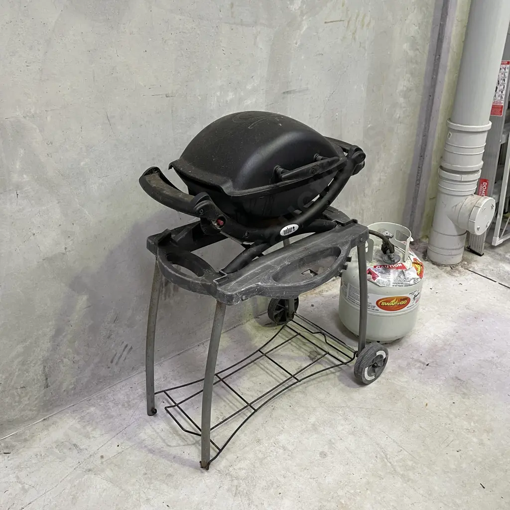 Weber Baby Q portable BBQ and stand with gas bottle. Working condition as shown in photos. Image 1++