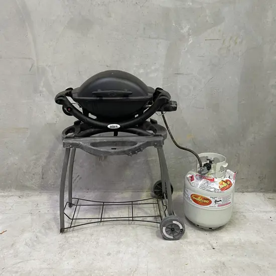 Weber Baby Q portable BBQ and stand with gas bottle. Working condition as shown in photos.