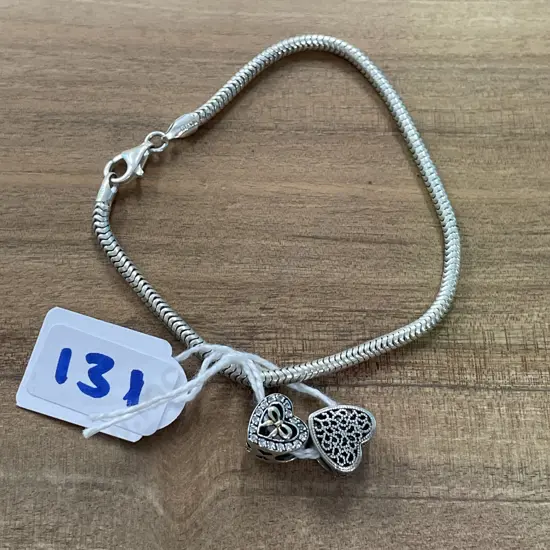 Sterling Silver Bracelet with two charms. F/N 1MO1UE