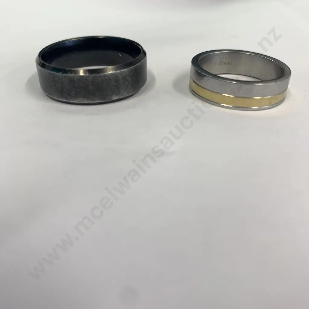Pair of Mens Rings, one silver coloured engraved with 'Chisel Steel' and one Black Image 1++