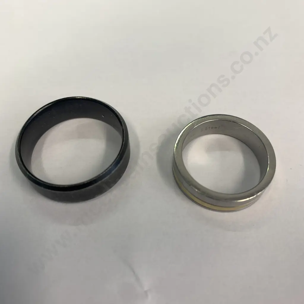 Pair of Mens Rings, one silver coloured engraved with 'Chisel Steel' and one Black Image 1++