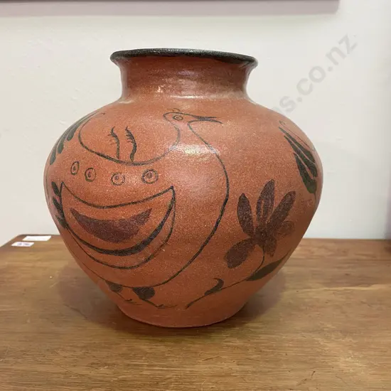 NZ Pottery Ovoid Vase with Stylised Bird Decoration on terracotta ground. Signed JR? Perhaps Roy Cowan. H22cm